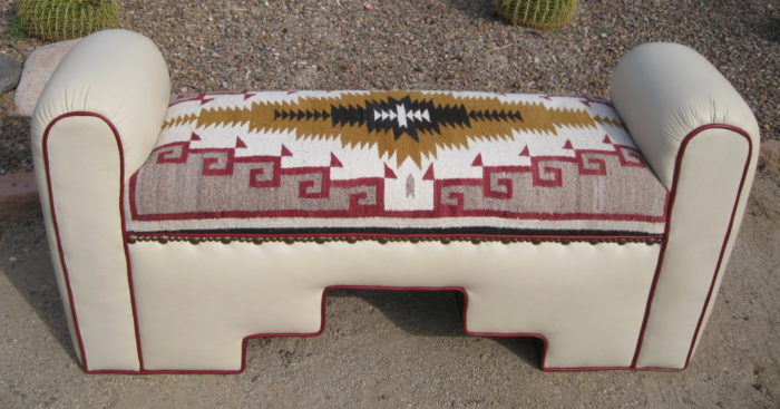 Vintage Navajo weaving on cream bench with red welt