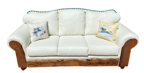 white leather sofa with curved top and decorative tacks