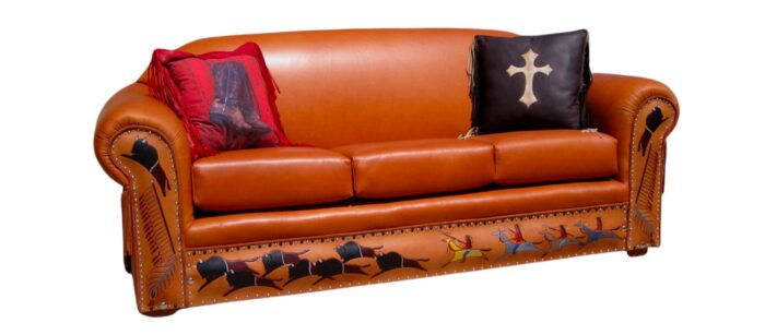 Tooled leather sofa with buffalo hunt art